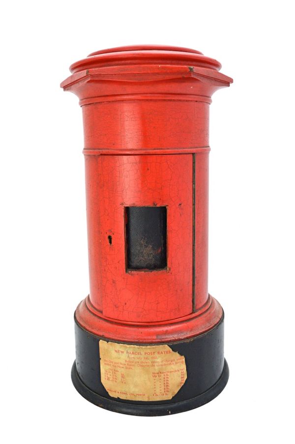 A red painted wooden domestic postal box, 20th century, of pillar form, on an ebonised base (a.f), 44cm high. Illustrated