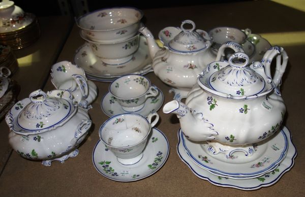 A Ridgway porcelain composite rococo moulded part tea service, 1840's, painted with scattered cornflowers, comprising; a teapot, cover and a stand, a