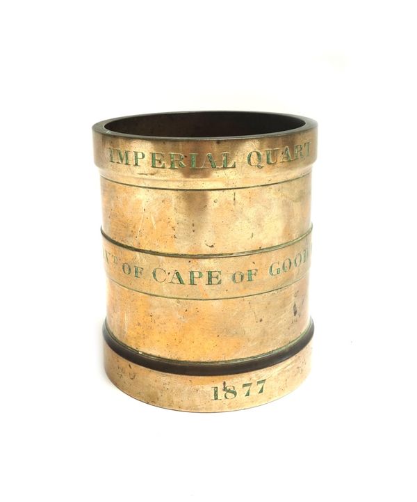 A bronze Imperial Quart measure, dated 1877 and stamped 'Govt of Cape of Good Hope', 13.5cm high.