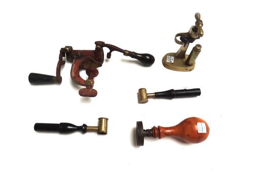 A Hawksleys patent cartridge topper, 13cm, another brass cartridge topper, a bronze seal with turned fruitwood handle, the matrix with Royal Standard