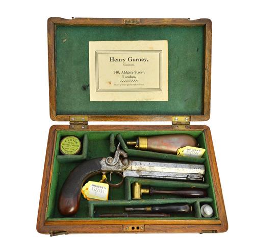 A 19th century percussion pistol by Henry Gurney, with octagonal steel barrel engraved to the top, one piece chequered grip, with accessories in an oa