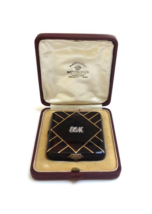 A French tortoiseshell and silver gilt powder compact, 20th century, with monogram to the lid and a fitted interior, in a Mappin & Webb box (a.f), the