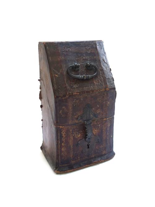 A leather bound wooden stationery box, probably 18th century, with gilt foliate embossed decoration, a hinged lid and steel lock plate (a.f), 29.5cm h