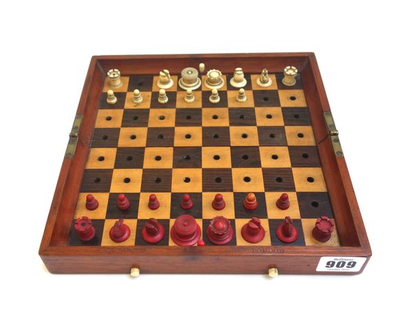 A Jaques 'In Statu Quo' stained bone travelling chess set, circa 1900, in original folding mahogany case (lacking three pawns and one knight).