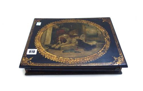 A Victorian papier mache writing slope, the hinged lid decorated with a dog group, 32cm wide, a Victorian papier mache twin division tea caddy with fo