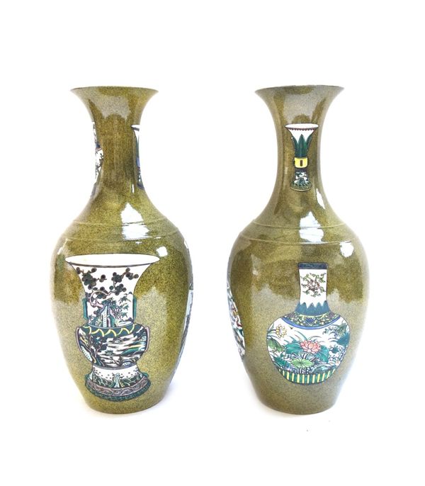 A pair of Chinese vases, late 20th century, six character mark to base, decorated with six further Chinese vases against a spinach green ground, 42.2c