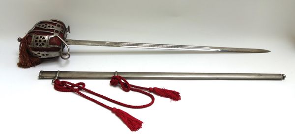 A Scottish parade sword with double edged engraved steel blade, (79cm), steel basket hilt and liner and wire bound leather grip in a metal scabbard.