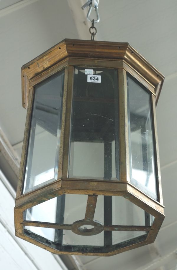A gilt metal and glass hall lantern, 19th century, of octagonal form, with domed top and inset bevelled panels (a.f), 49cm high.