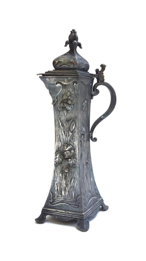 A W.M.F pewter ewer of Art Nouveau design, with hinged lid over a square section tapering body relief cast with flowers, stamped marks to base, 36cm h