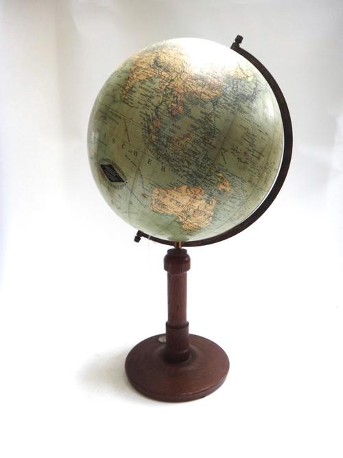 A German twelve inch 'Columbus' table globe by 'Dr. R. Neuse', 20th century, mounted on a turned oak stand and circular foot, 62cm high overall.