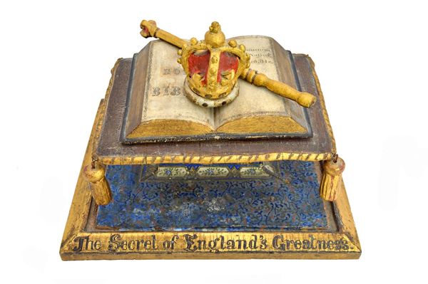 A Victorian style carved wood and plaster model of a crown and cushion, gilt titled to the plinth 'The secret of England's greatness', 26.5cm wide. Il