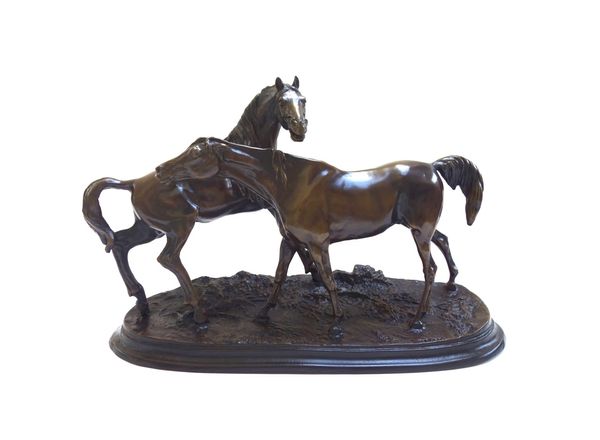 After P.J. Mene (1810-1879); a bronze sculpture, late 19th/early 20th century, depicting two horses on an oval naturalistic base, signed to the cast,