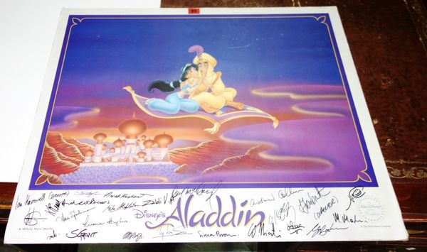 An 'Aladdin' poster on board signed by the crew. SH4