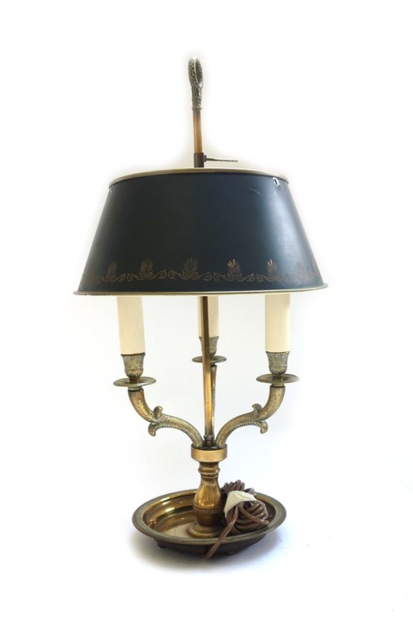 A bouillotte table lamp, 20th century, with foliate cast ring handle, green tin adjustable shade and three light fitment on a circular dished base, 62