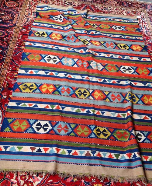 A South Persian gelim, the field with bands of polychrome motifs, 273cm x 174cm.
