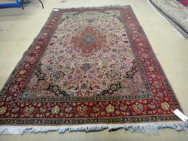 A Tehran carpet Persian, water damaged, the ivory field with central medallion all with floral sprays, a burgundy palmette border, 395cm x 200cm.