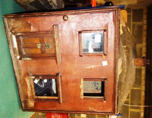 An early 20th century scratch built doll's house, with a small quantity of furniture, (qty).