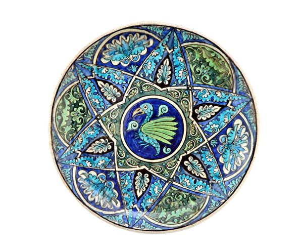 A William de Morgan Persian ware plate by Charles Passenger, circa 1890, centred with a wild bird and bordered with an Iznik foliate border, with pain