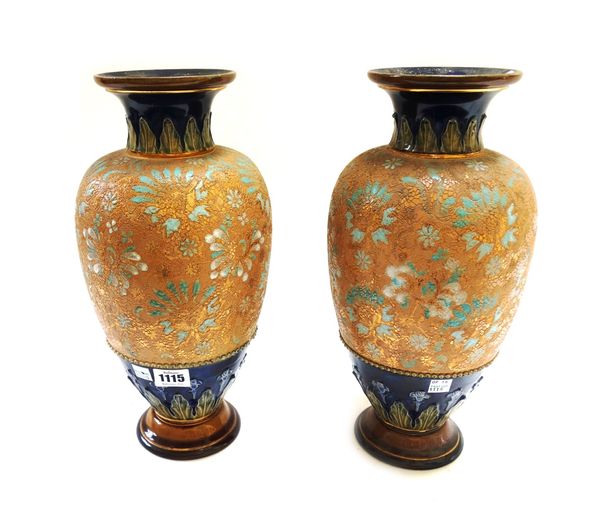 A pair of Royal Doulton stoneware vases, early 20th century, chine decorated against a cobalt blue ground, impressed marks. 34.5cm h. (2)
