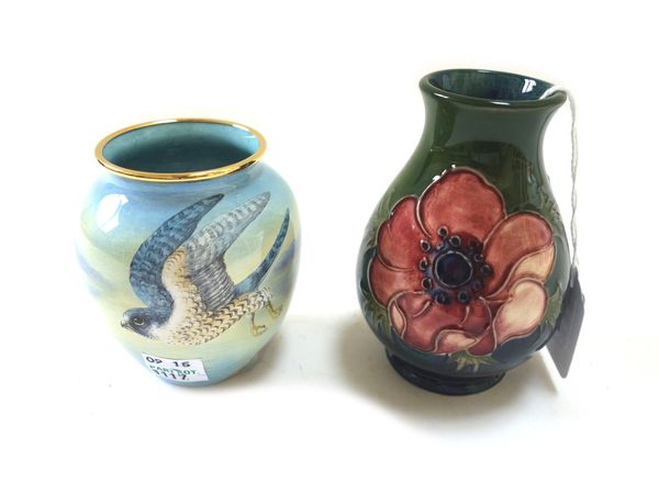 A Moorcroft "anemone" pottery vase, circa 1930, green/blue ground, 9.5cm high, and a Moorcroft enamel vase, 'Peregrine Falcon', limited edition 23/75,