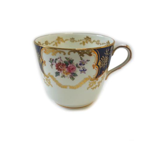 A Coalport bone china part dinner and tea service, early 20th century, printed and coloured with panels of flowers against a deep blue ground, compris