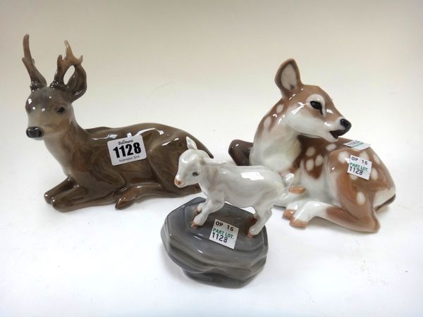 Three Royal Copenhagen animals; Young Stag 756, Doe 2609 and Small Lamb Atop a Rock 4760, the first 16cm wide. (3)