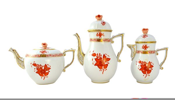 A Herend porcelain part tea service decorated in the 'Rust Bouquet' pattern, comprising; a coffee pot and cover, a teapot and cover, a hot water jug a