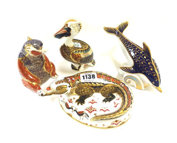 Four Royal Crown Derby Imari porcelain paperweights modelled as animals, comprising; a crocodile, a brown pelican, a bear and a dolphin, all with gold