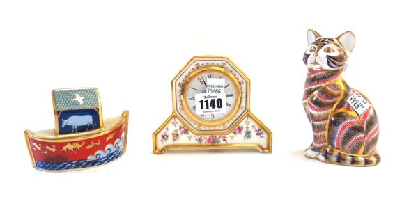 A Royal Crown Derby 'Royal Antoinette' porcelain mantel clock, 10.5cm high, boxed, and two second quality Imari paperweights; a seated cat and Noah's