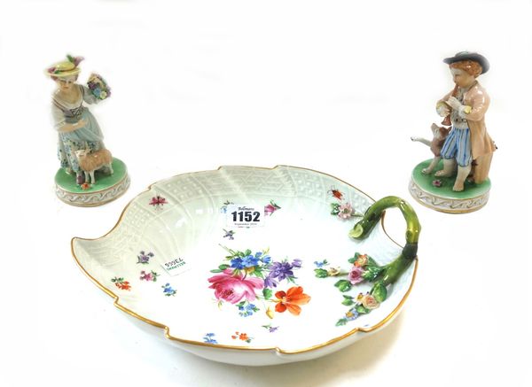 A 20th century Meissen porcelain dish of leaf form, 25cm wide, a Meissen teapot, three Meissen teacups and saucers of quatralobe form decorated with p