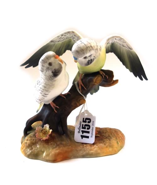 Six Royal Crown Derby porcelain birds, comprising; Woodpecker, 15cm high, Blue Tit and Chicks by K. Wood, Kingfisher signed M.E.J, and three further b