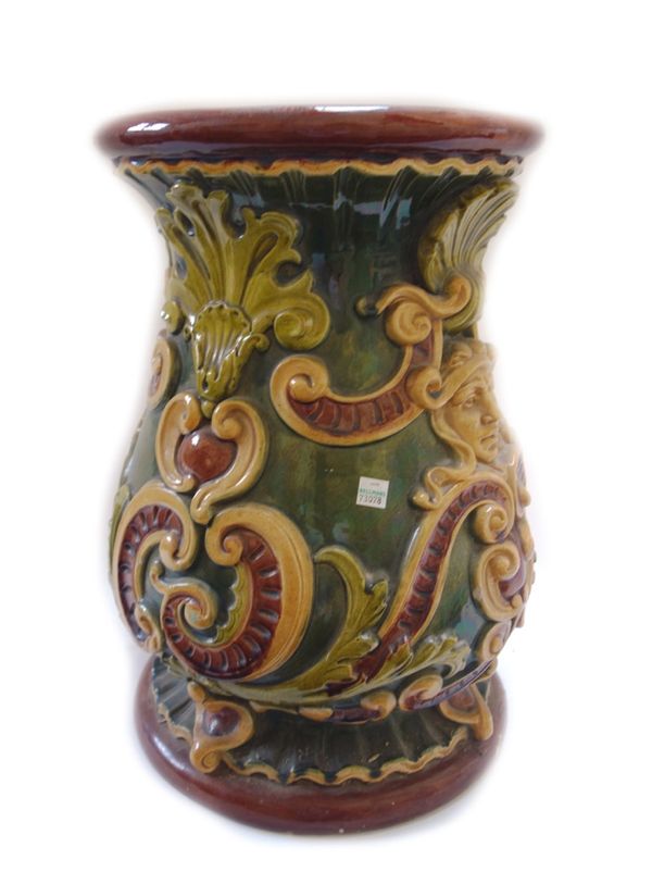 A majolica garden seat of baluster form, late 19th century, relief moulded with shells, masks and foliate scrolls, 45.5cm high.