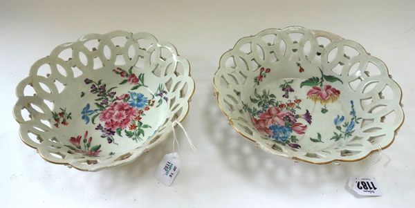 A pair of Worcester circular pierced baskets, circa 1765, each painted in the studio of James Giles with flower sprays, (a.f), 21cm diameter. (2)