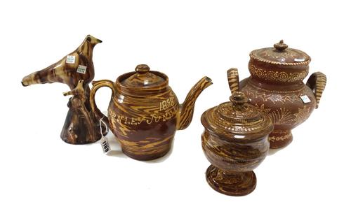 A surface agate double spouted teapot and cover, dated 1898, probably Cliviger Pottery, Burnley, inscribed in slip, ` Mrs Entwistle Burnley June 1898'