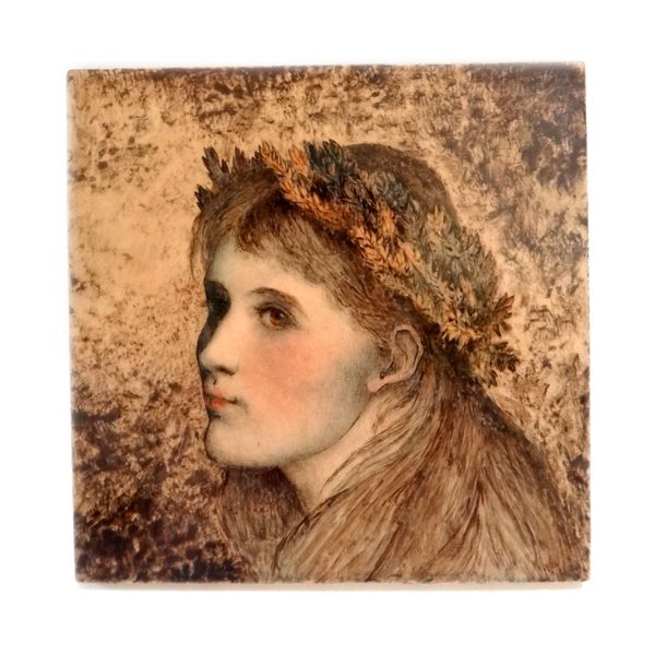 A Minton pottery tile, circa 1860's, depicting a female portrait with foliate garland to her hair, against a brown and beige ground, detailed 'Minton