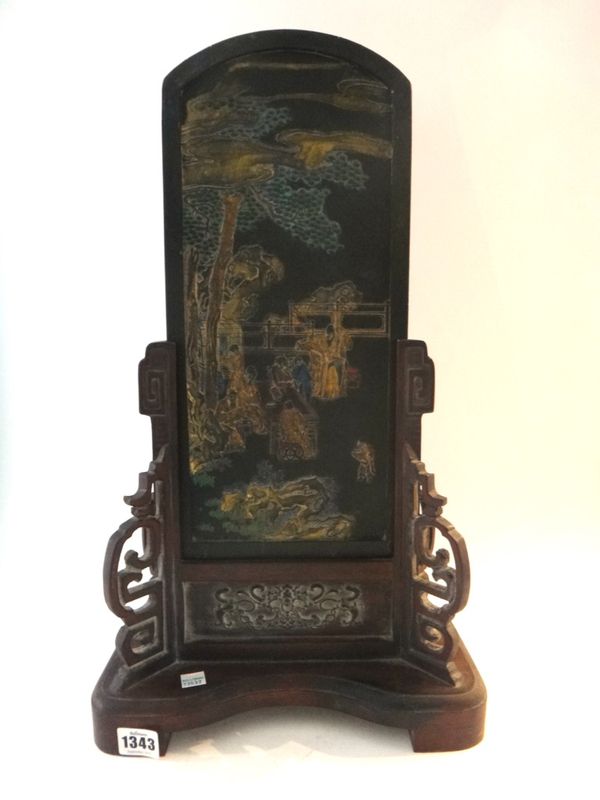 A large Chinese moulded ink cake and wood stand, 20th century, with a scholarly scene and an inscription to the reverse, 53cm. overall height, boxed;