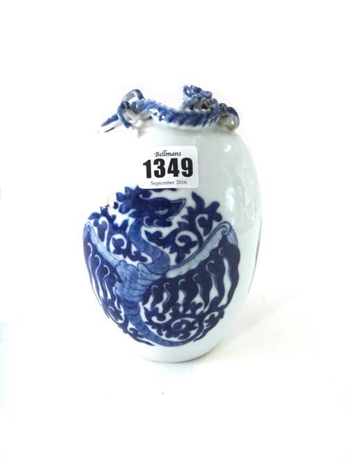 A Chinese blue and white egg-shaped vase, 20th century, painted with phoenix roundels, the rim applied with a dragon and bat, blue Qianlong seal mark,