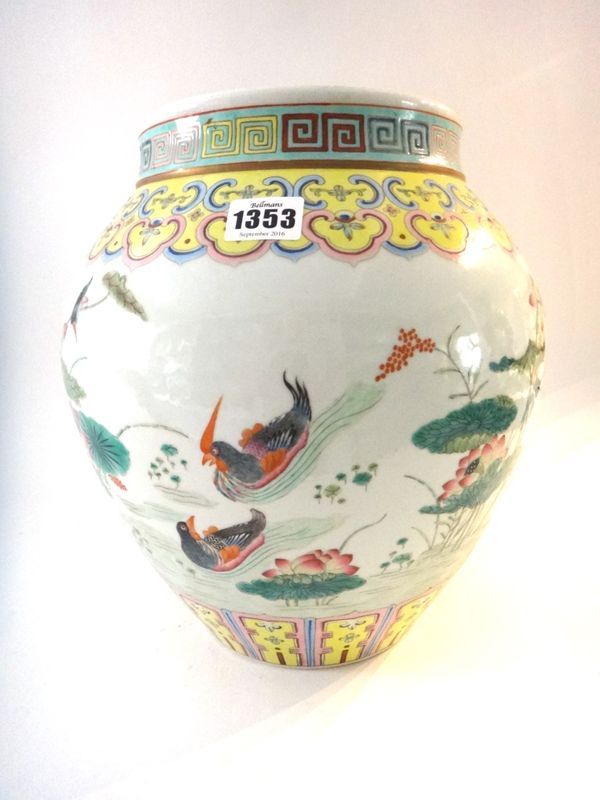 A Chinese famille-rose ovoid vase, 20th century, painted with birds and ducks amongst lotus beneath a ruyi border, 31cm. high