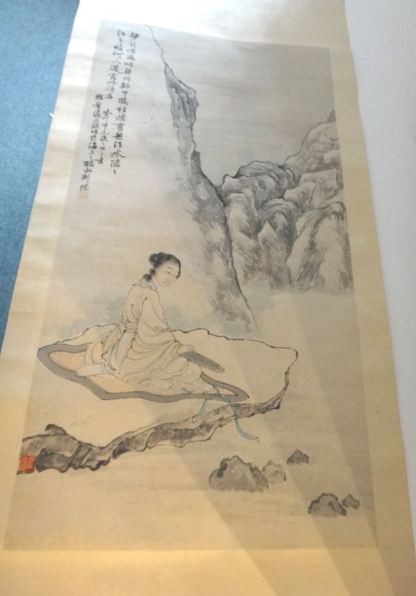 Attributed to Pan Zhenyong (1852-1942) ,a scroll painting of a woman seated on a rock playing the koto, 83cm. by 44cm.