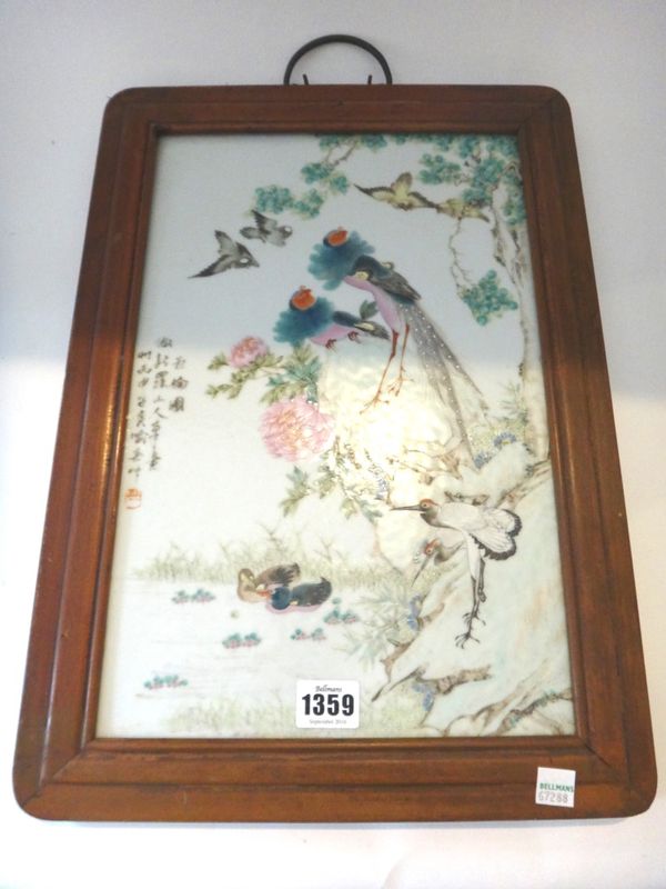 A Chinese famille-rose rectangular plaque, 20th century, painted with birds on rocks and in flight and ducks swimming, signed, 36.5cm. by 23.5cm., fra