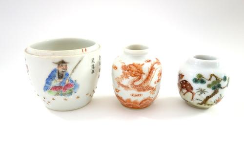 Two Chinese miniature porcelain ovoid vases, 20th century, one painted in iron-red with two dragons amongst breaking waves, the other painted with a d