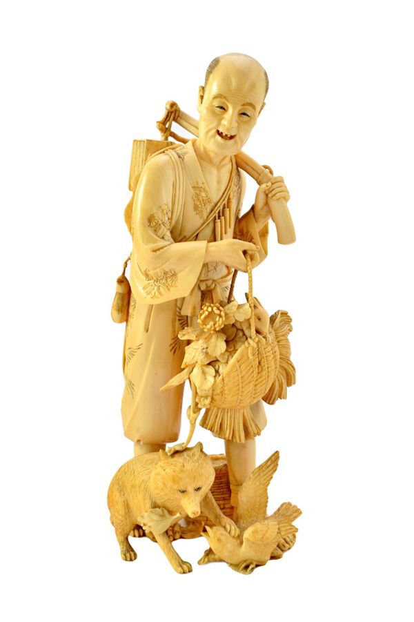 A Japanese ivory okimono of a tradesman, Meiji period, standing carrying a basket of flowers on which sits a hare, a basket, a fox and bird at his fee