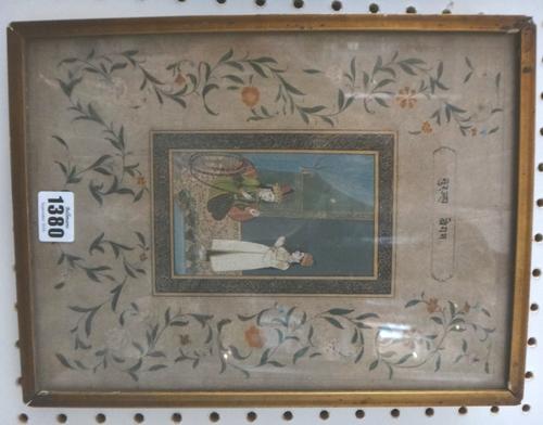 An Indian miniature, 19th century, opaque pigments on paper, painted with a seated figure smoking a hookah with attendant standing beside, within a bl