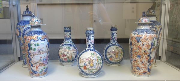 A group of Chinese export mandarin palette porcelains, Qianlong, each piece painted with figurative panels inside underglaze-blue frames, comprising;