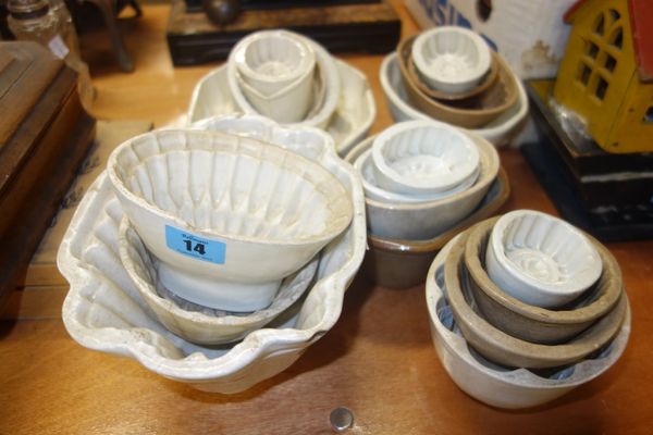 A group of early 19th century and later pottery jelly moulds of assorted patterns and designs, (qty).