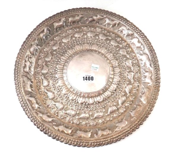A Thai silver circular tray, 20th century, the centre with plain boss inside embossed bands of birds and animals divided by bands of foliage, unmarked