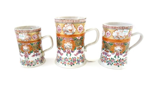A set of three Chinese `Compagnie des Indes' tankards, Qianlong, cylindrical form with flared bases, each painted with panels of birds and flowers abo
