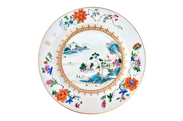 Six Chinese famille rose dishes en suite Qianlong, of graduating size, each painted in the centre with a river landscape inside a gilt spearhead borde