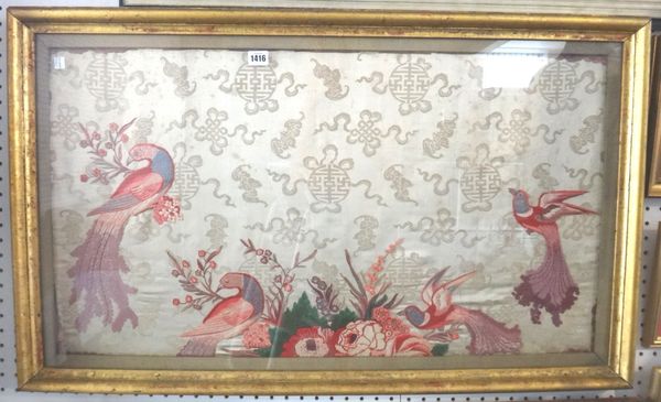 A Chinese embroidered panel, 20th century, worked with four colourful pheasants amongst flowering shrubs against a deep cream ground filled with buddh