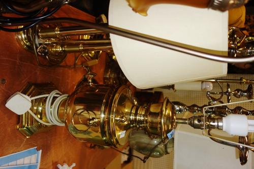 A quantity of 20th century brass table lamps and a silver plated four branch candelabra, (qty).